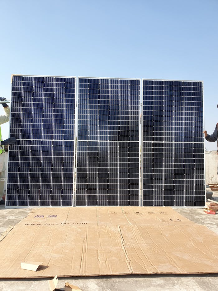 gallery-4 Rooftop solar panels in Islamabad under a clear sky representing sustainable energy.