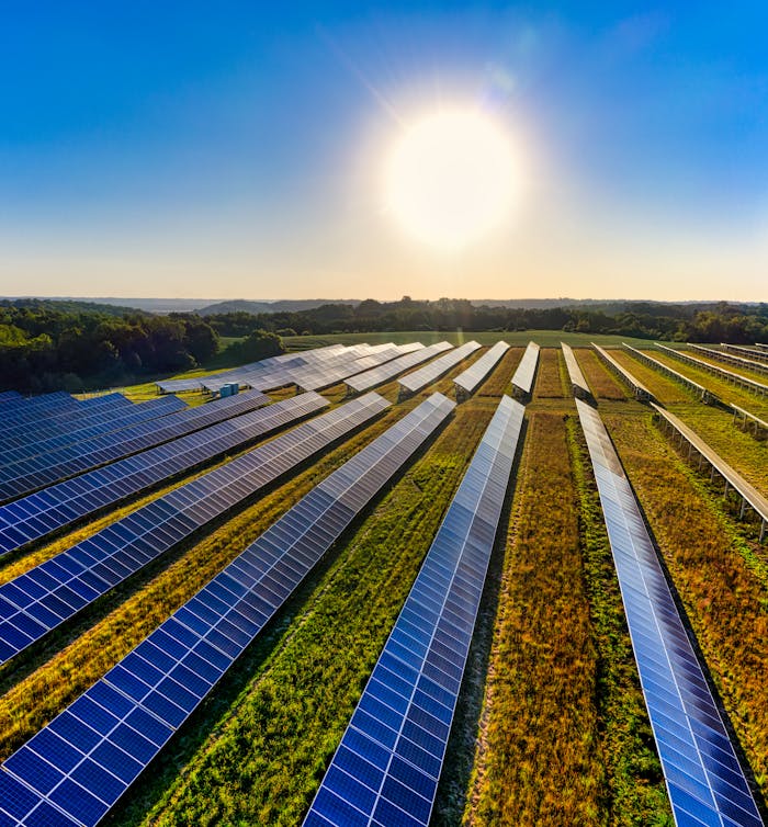 gallery-5 Aerial view of a solar farm in Red Wing, MN, with solar panels harnessing the sun's energy.